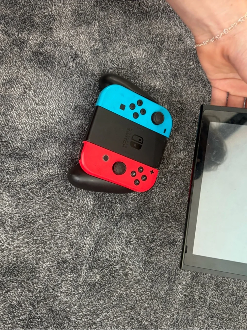 Nintendo Switch with Red & Blue Joy-Con Controllers + hand held controller